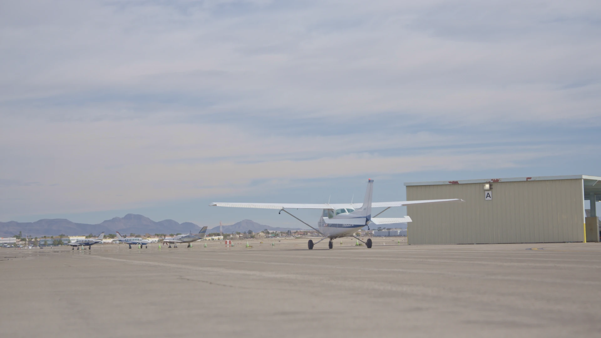 Back view of an airplane taking off from a runway
