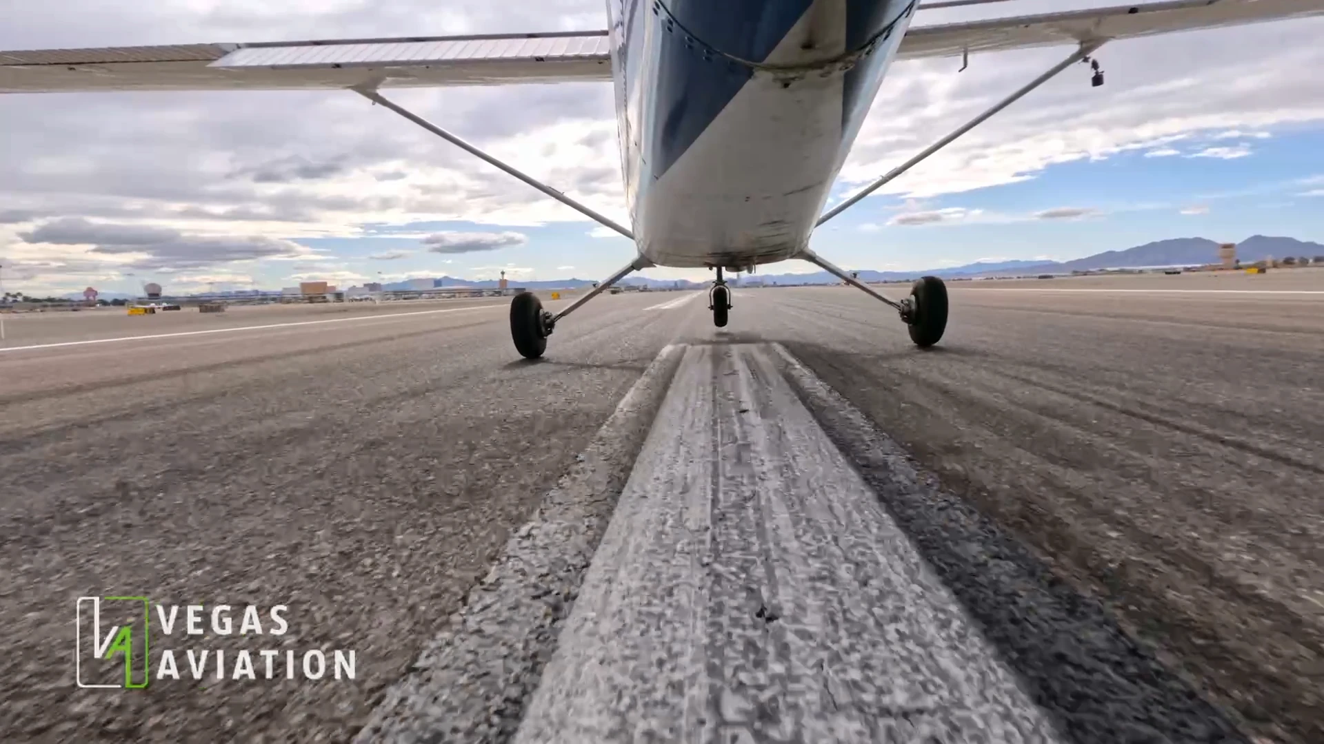 Low angle bottom view of an airplane taking off from a runway